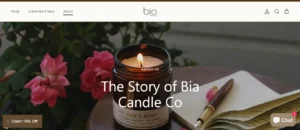Bia Candle Co. "The Story" banner featuring a hand-poured amber jar candle, pink roses, and a vintage fountain pen on a notebook.